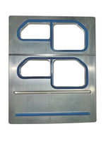 Metal template with cut-out shapes on a white background