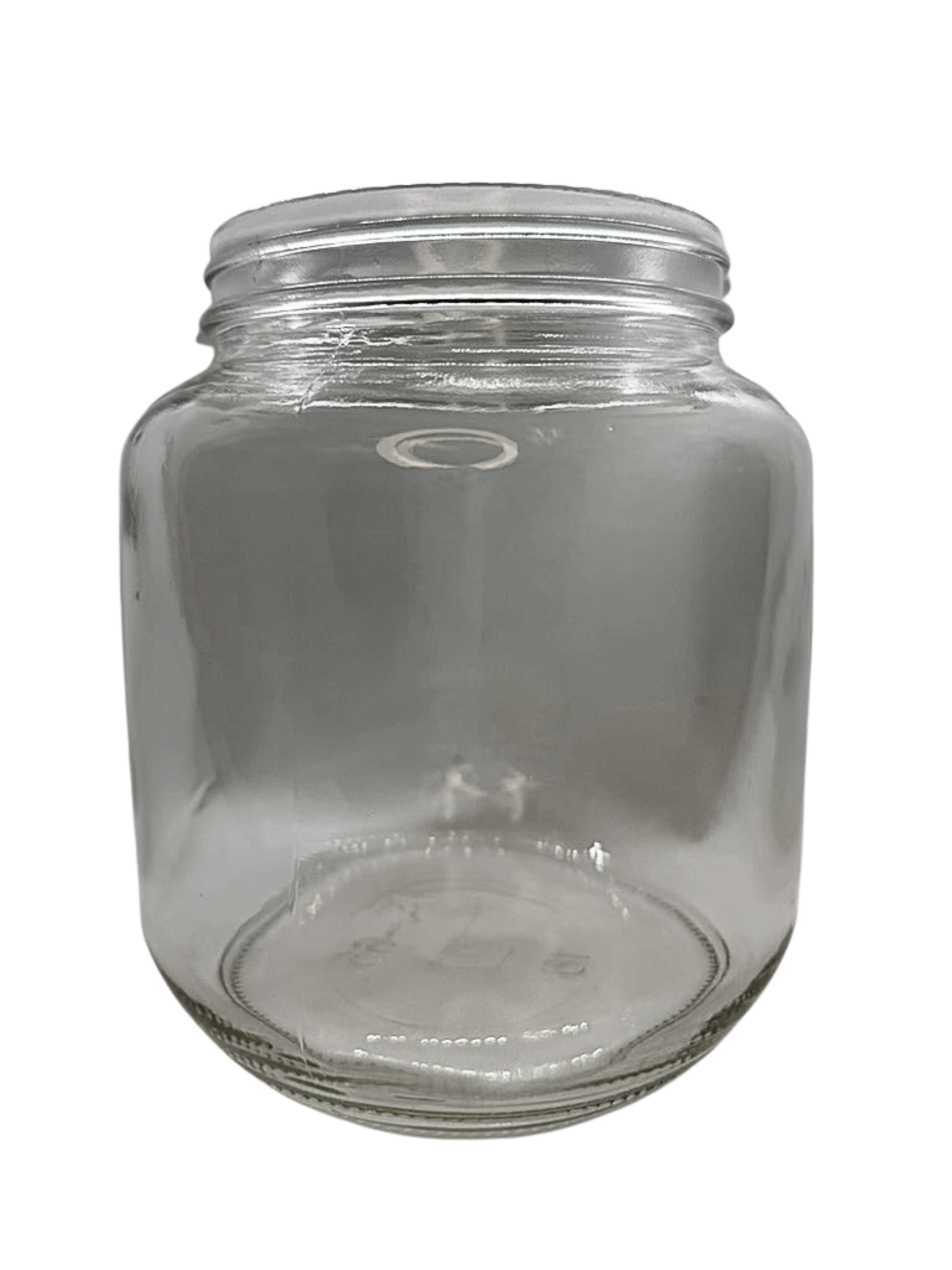 Clear glass jar with a metal lid on a white background