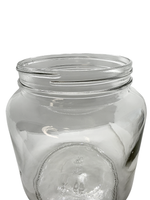 Clear glass jar with a lid on a white background
