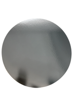Round metallic object on a white background