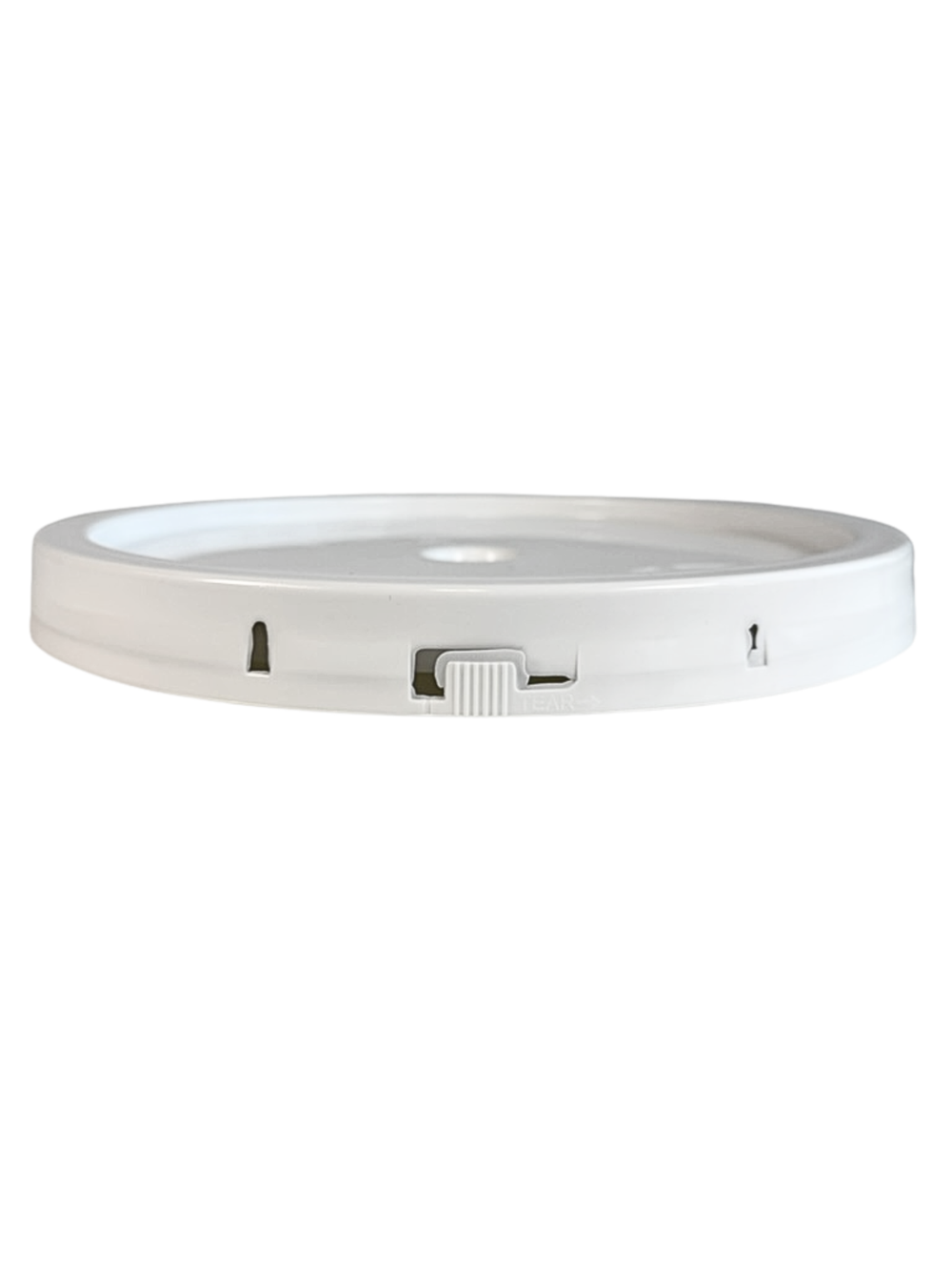Round white electronic device on a white background