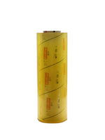 Roll of yellow plastic sheeting on a white background
