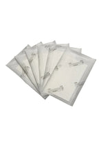 Stack of white filter pads on a white background