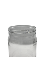 Clear glass jar with a metal lid on a white background