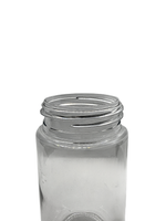 Clear glass jar with metal lid on a white background