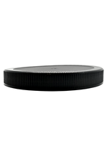 Black plastic lid on a white background
